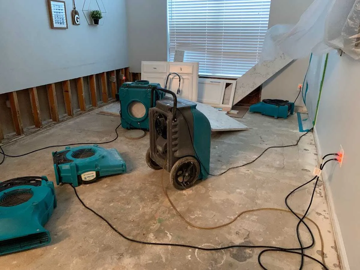 Dehumidifier in flood-cut room for Water Damage Restoration in University